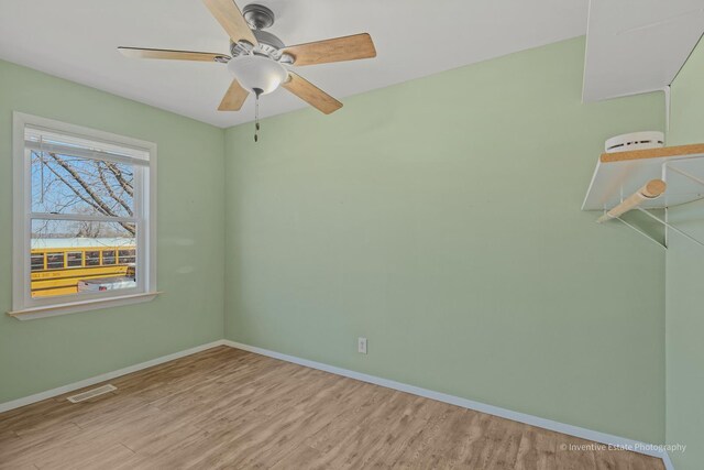 308 Eaton Ave, Romeoville, IL 60446 - spare room with ceiling fan, visible vents, baseboards, and wood finished floors