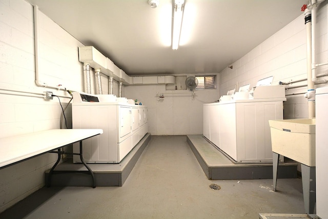 4731 Saint Joseph Creek Rd Unit 5G, Lisle, IL 60532 - below grade area with a sink, washer and clothes dryer, and concrete block wall