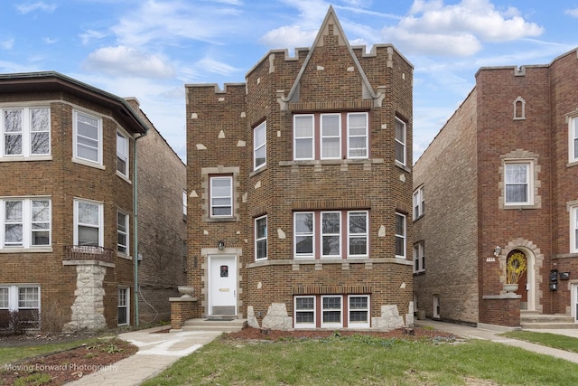 1916 Kenilworth Ave, Berwyn, IL 60402 - tudor-style house featuring brick siding, entry steps, and a front lawn
