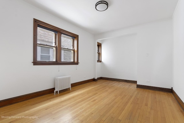 1916 Kenilworth Ave, Berwyn, IL 60402 - unfurnished room with light wood-type flooring, radiator, baseboards, and ornamental molding