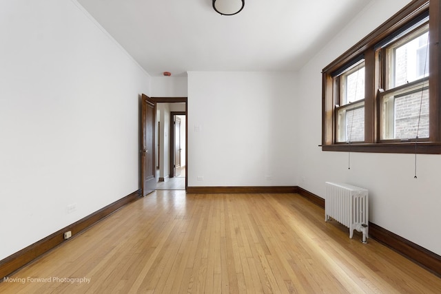 1916 Kenilworth Ave, Berwyn, IL 60402 - spare room with light wood-style flooring, radiator heating unit, and baseboards