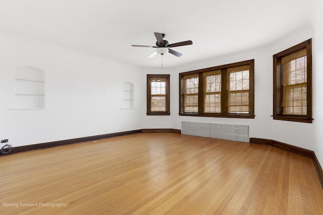 1916 Kenilworth Ave, Berwyn, IL 60402 - empty room with light wood-style floors, built in features, ceiling fan, and baseboards