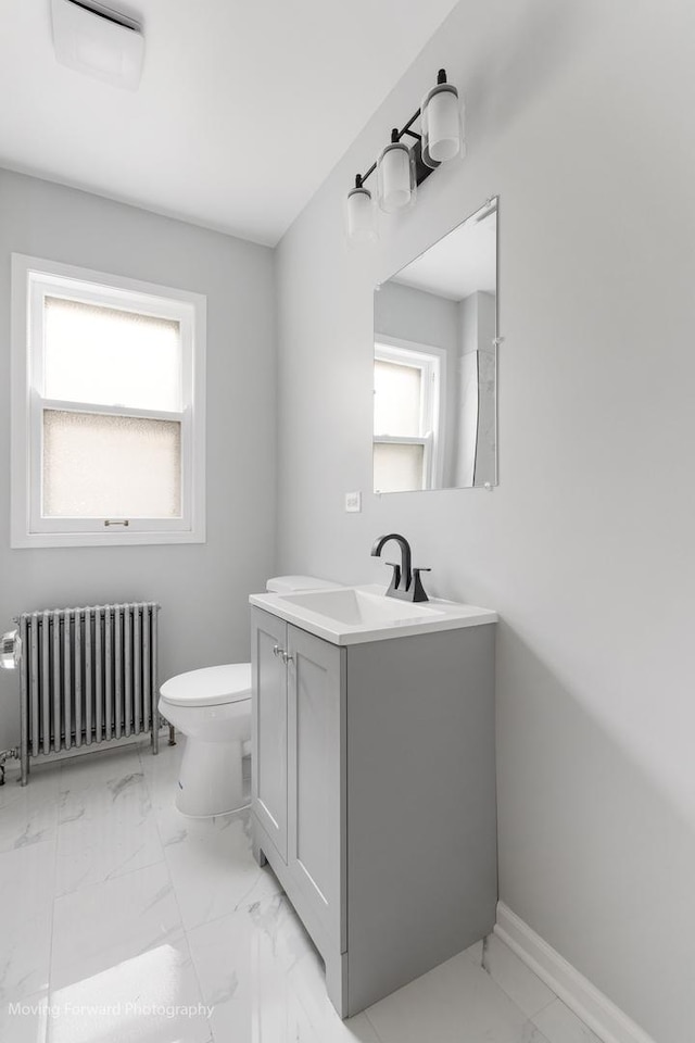 1916 Kenilworth Ave, Berwyn, IL 60402 - bathroom with baseboards, toilet, radiator, vanity, and marble finish floor
