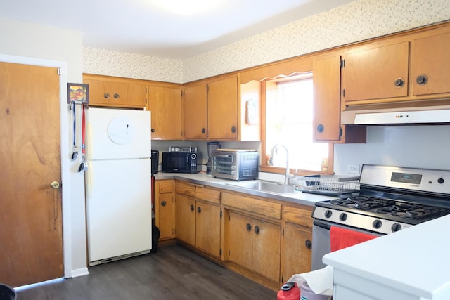 14435 Karlov Ave, Midlothian, IL 60445 - kitchen featuring a sink, freestanding refrigerator, dark wood-style floors, under cabinet range hood, and stainless steel gas stove