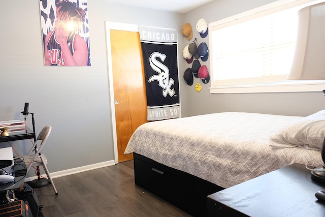 14435 Karlov Ave, Midlothian, IL 60445 - bedroom with baseboards and dark wood-style floors