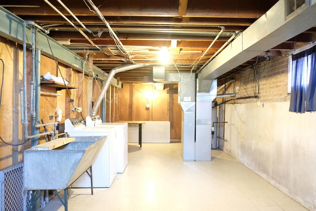 14435 Karlov Ave, Midlothian, IL 60445 - unfinished basement with washing machine and dryer, visible vents, heating unit, and a sink