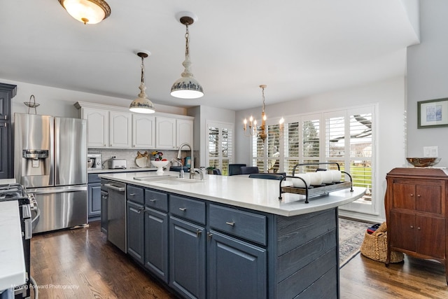 2219 Barrett Dr, Algonquin, IL 60102 - kitchen featuring stainless steel appliances, white cabinetry, light countertops, and dark wood-style floors