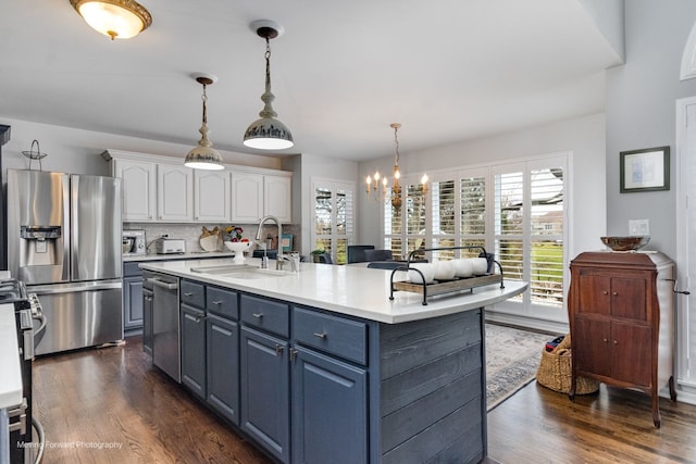 2219 Barrett Dr, Algonquin, IL 60102 - kitchen featuring stainless steel appliances, white cabinetry, dark wood-type flooring, light countertops, and a chandelier