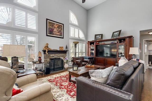 2219 Barrett Dr, Algonquin, IL 60102 - living area with a towering ceiling, wood finished floors, healthy amount of natural light, and a stone fireplace