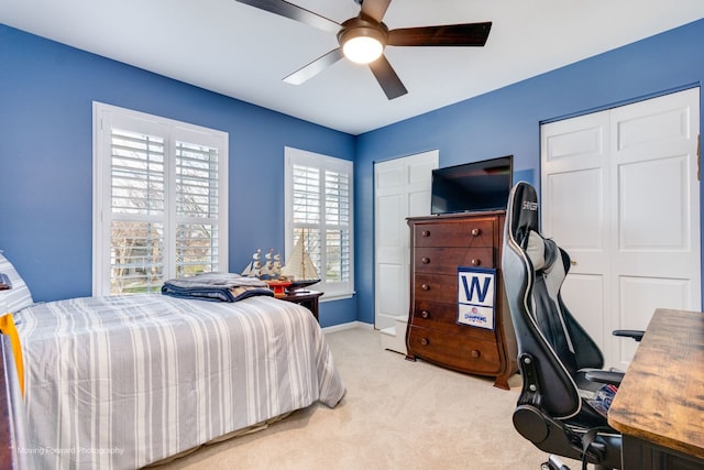 2219 Barrett Dr, Algonquin, IL 60102 - bedroom with light carpet, ceiling fan, an office area, and multiple closets