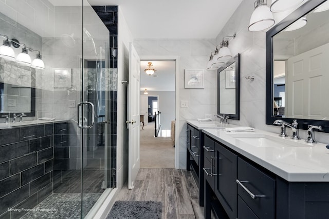 2219 Barrett Dr, Algonquin, IL 60102 - bathroom with double vanity, wood finished floors, and a stall shower