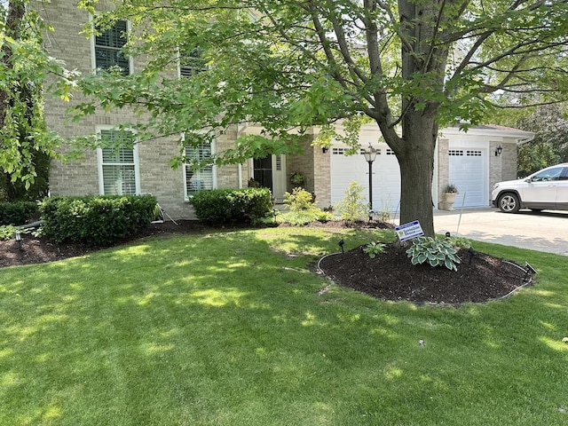 2219 Barrett Dr, Algonquin, IL 60102 - view of front of home featuring brick siding, driveway, a front lawn, and a garage