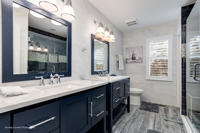 2219 Barrett Dr, Algonquin, IL 60102 - bathroom with tile walls, double vanity, a stall shower, and wood finished floors