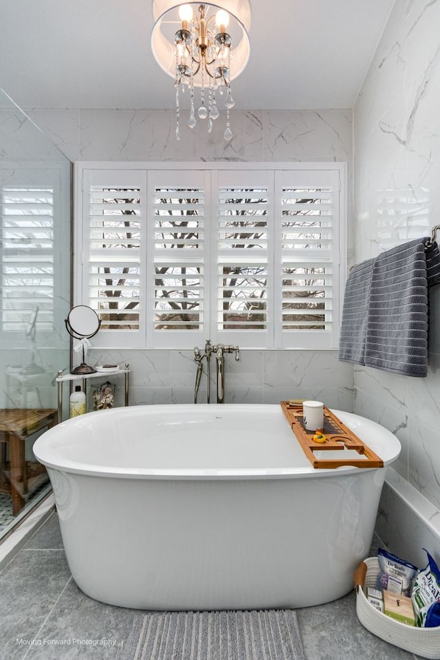 2219 Barrett Dr, Algonquin, IL 60102 - bathroom featuring healthy amount of natural light, tile walls, and a soaking tub