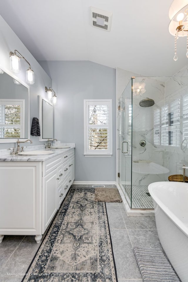 2219 Barrett Dr, Algonquin, IL 60102 - bathroom featuring double vanity, a marble finish shower, a soaking tub, lofted ceiling, and tile patterned floors