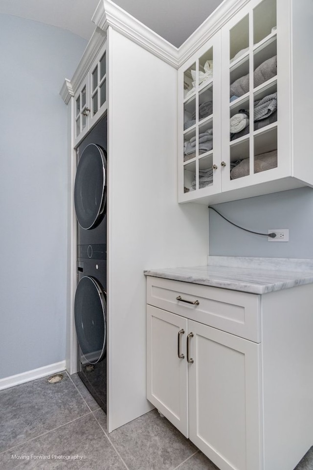 2219 Barrett Dr, Algonquin, IL 60102 - laundry room featuring estacked washer and dryer and cabinet space