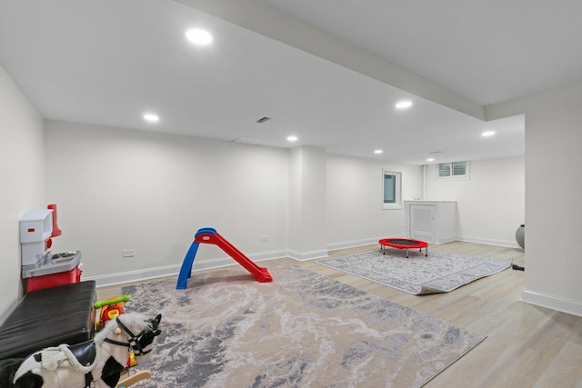 rec room featuring wood finished floors, baseboards, visible vents, and recessed lighting