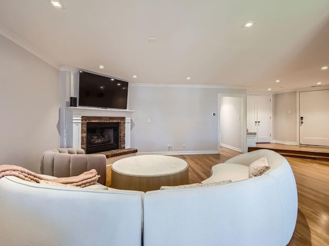 9748 Mill Dr E Unit 2E, Palos Park, IL 60464 - living area featuring baseboards, light wood-style flooring, ornamental molding, a fireplace, and recessed lighting