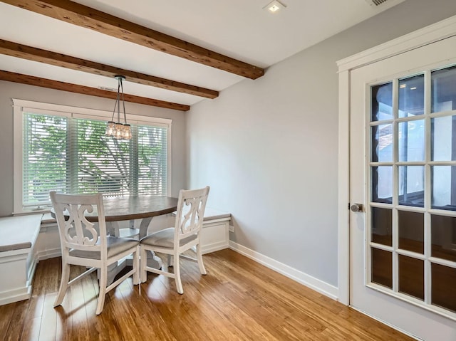 9748 Mill Dr E Unit 2E, Palos Park, IL 60464 - dining area with light wood-style flooring, baseboards, a chandelier, and beam ceiling