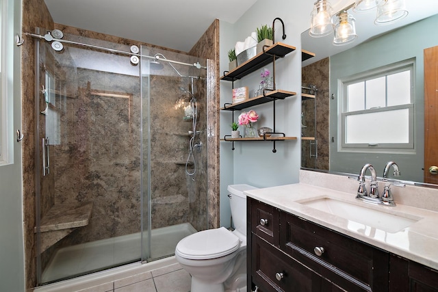 full bathroom with toilet, a stall shower, vanity, and tile patterned flooring