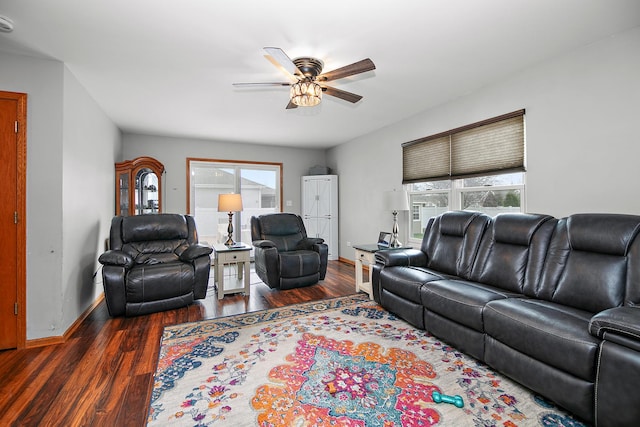 living area featuring ceiling fan, wood finished floors, and baseboards