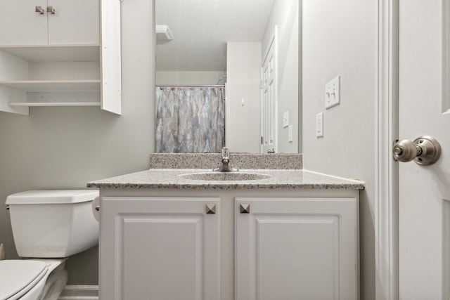 bathroom with a shower with shower curtain, toilet, and vanity
