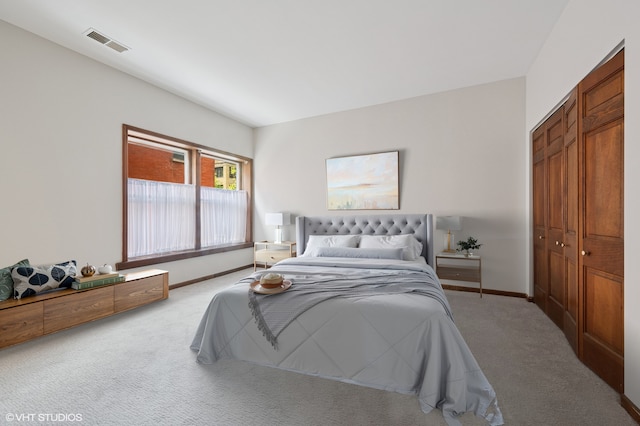 bedroom with carpet flooring, baseboards, and a closet