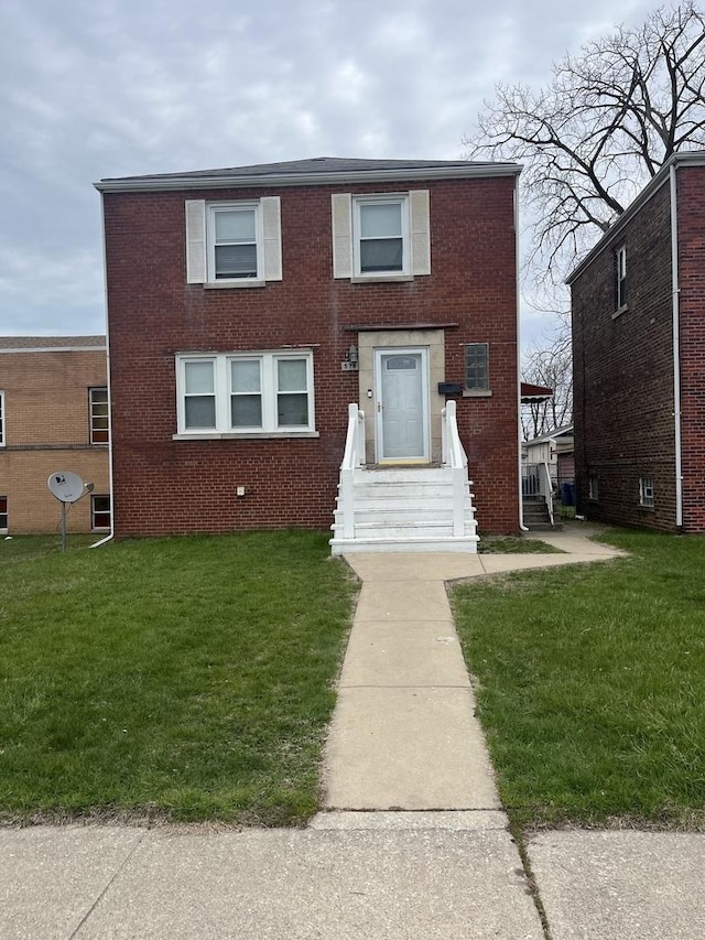 579 Price Ave, Calumet City, IL 60409 - view of front of home featuring brick siding and a front lawn