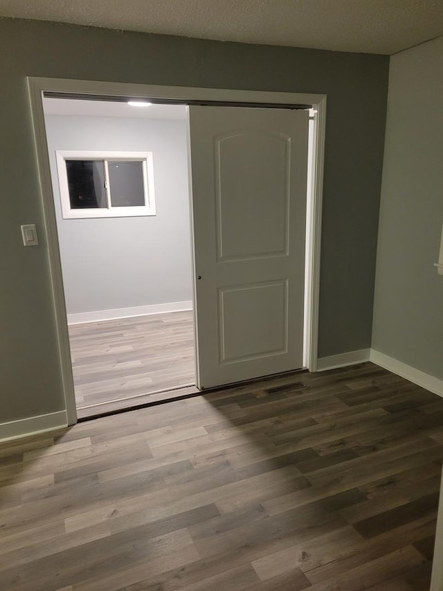 579 Price Ave, Calumet City, IL 60409 - spare room with baseboards and wood finished floors