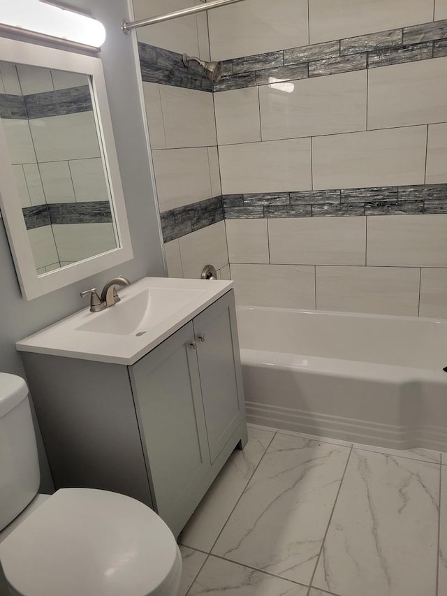 579 Price Ave, Calumet City, IL 60409 - full bath with marble look tiles, toilet, vanity, and shower / bathtub combination