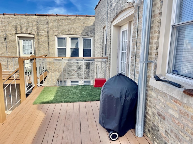 deck featuring a grill