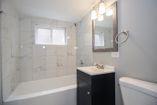 bathroom with toilet, shower / tub combination, and vanity