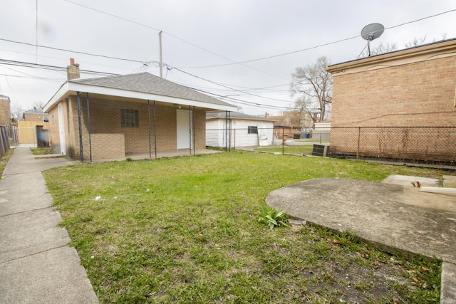 view of yard with fence and a gate