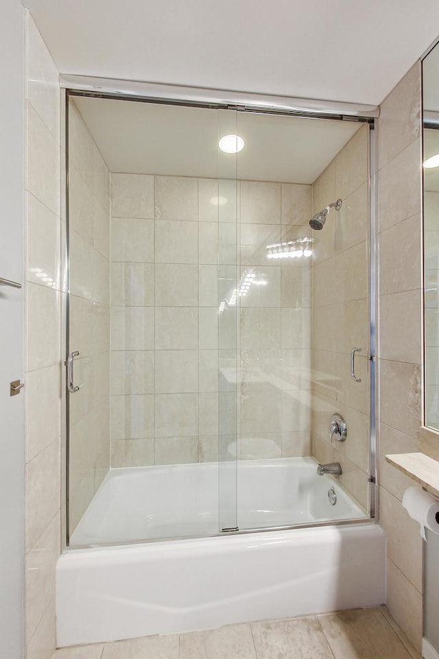 600 N Kingsbury St Unit 1612, Chicago, IL 60654 - bathroom with combined bath / shower with glass door and tile patterned floors