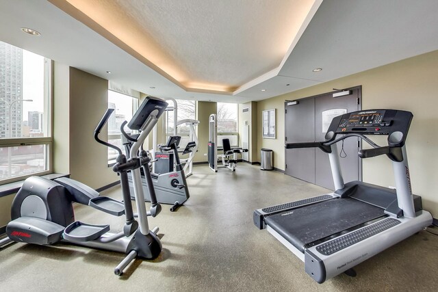600 N Kingsbury St Unit 1612, Chicago, IL 60654 - exercise room featuring baseboards and plenty of natural light