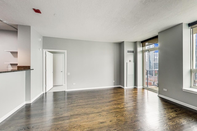 600 N Kingsbury St Unit 1612, Chicago, IL 60654 - unfurnished living room featuring baseboards, a textured ceiling, dark wood-style flooring, and floor to ceiling windows