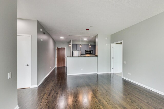 600 N Kingsbury St Unit 1612, Chicago, IL 60654 - unfurnished living room with dark wood-style flooring and baseboards