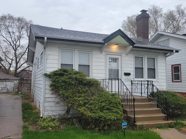 326 156th Pl, Calumet City, IL 60409 - bungalow-style home with a shingled roof and a chimney