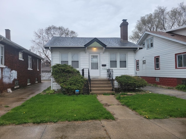 326 156th Pl, Calumet City, IL 60409 - bungalow-style house featuring a chimney, a front lawn, and roof with shingles