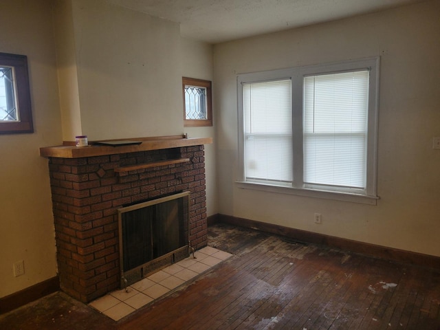 326 156th Pl, Calumet City, IL 60409 - unfurnished living room with baseboards, hardwood / wood-style floors, and a fireplace