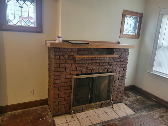 326 156th Pl, Calumet City, IL 60409 - room details with baseboards, a brick fireplace, and wood finished floors