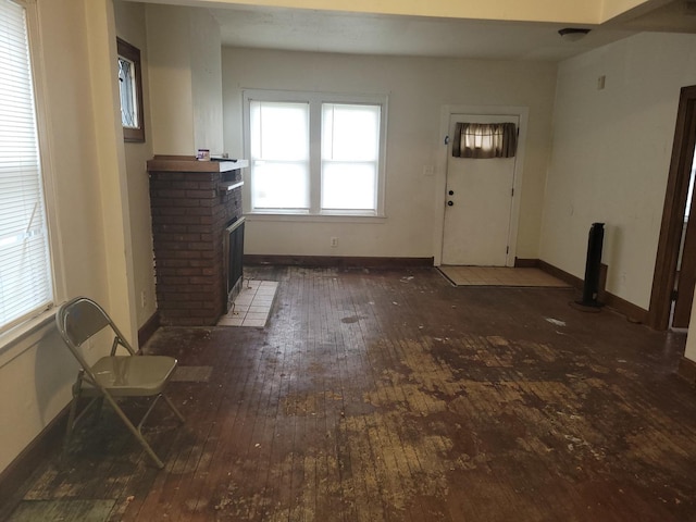 326 156th Pl, Calumet City, IL 60409 - unfurnished living room with baseboards, hardwood / wood-style floors, and a fireplace