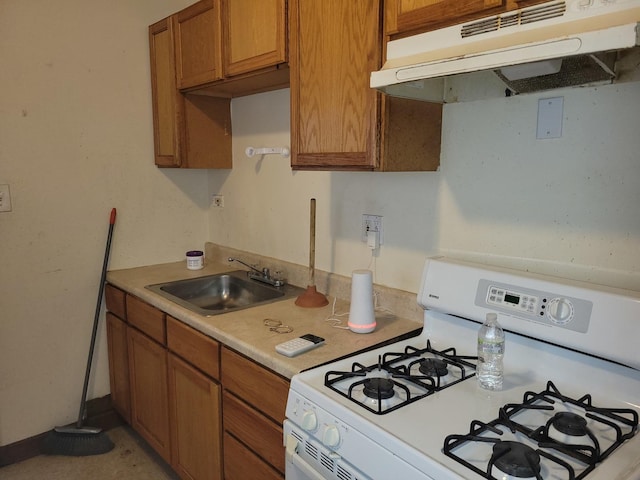 326 156th Pl, Calumet City, IL 60409 - kitchen with a sink, white range with gas stovetop, brown cabinetry, light countertops, and under cabinet range hood