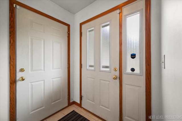 317 Plymouth Ct, Sycamore, IL 60178 - foyer entrance featuring light tile patterned floors and baseboards