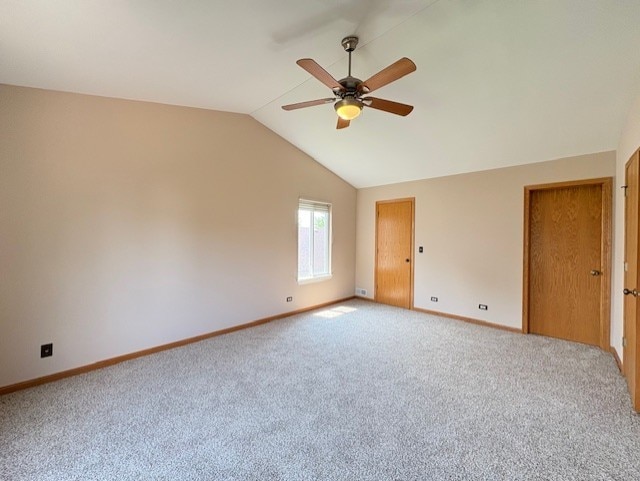 794 Meadowridge Dr, Aurora, IL 60504 - spare room featuring a ceiling fan, vaulted ceiling, and carpet floors