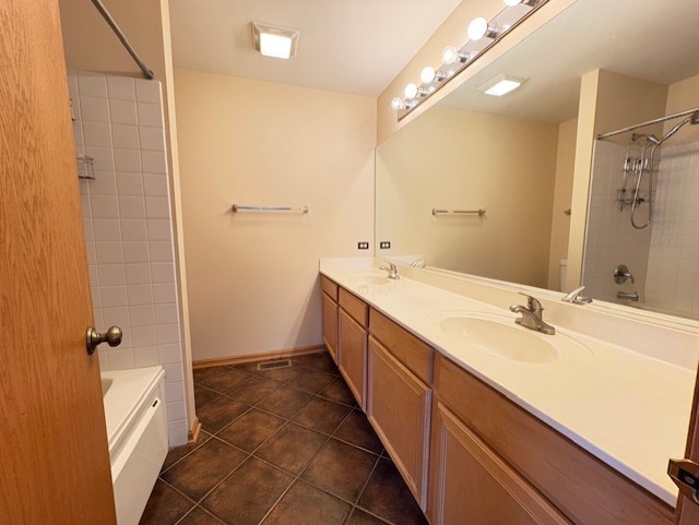 794 Meadowridge Dr, Aurora, IL 60504 - full bath featuring double vanity, tile patterned floors, and washtub / shower combination