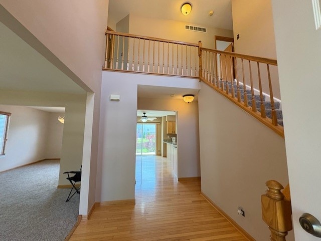 794 Meadowridge Dr, Aurora, IL 60504 - hallway with wood finished floors and a high ceiling