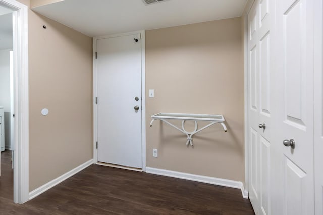 interior space with visible vents, wood finished floors, and baseboards