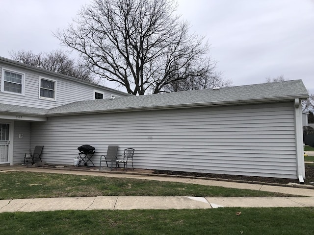 1351 N Glen Cir Unit A, Aurora, IL 60506 - view of property exterior with a shingled roof