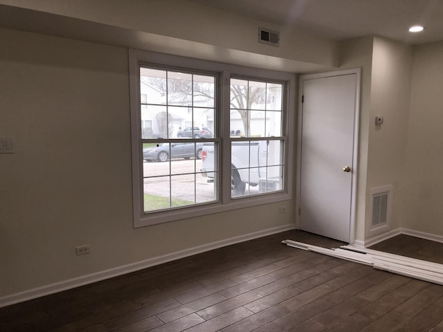 1351 N Glen Cir Unit A, Aurora, IL 60506 - unfurnished room featuring dark wood-style flooring, baseboards, visible vents, and recessed lighting